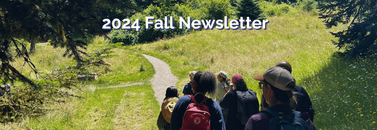 banner image of people walking down hiking trail on sunny day